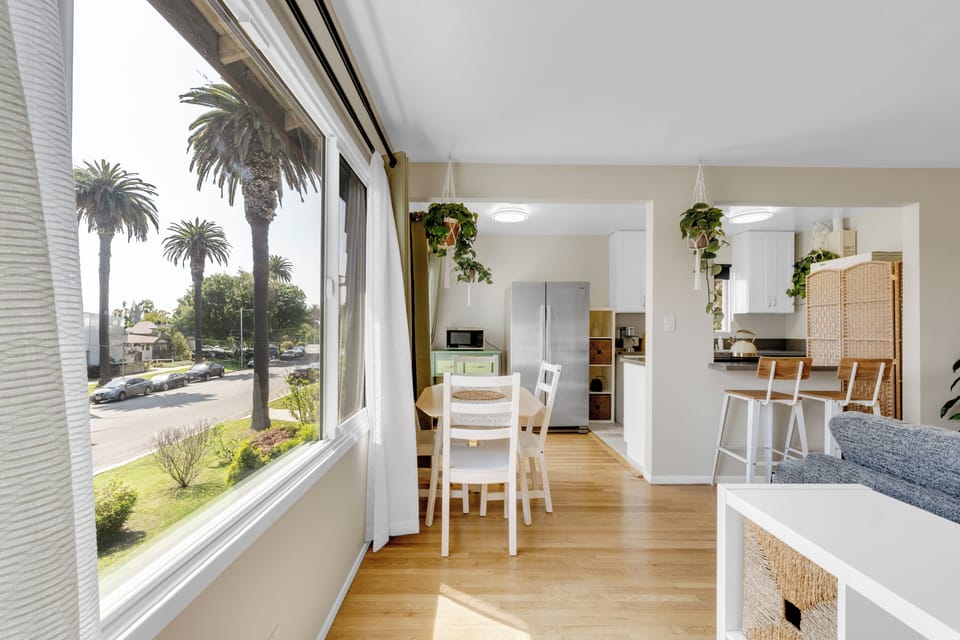 Enjoy views of picturesque East Blvd from the extendable dining table set for 4,