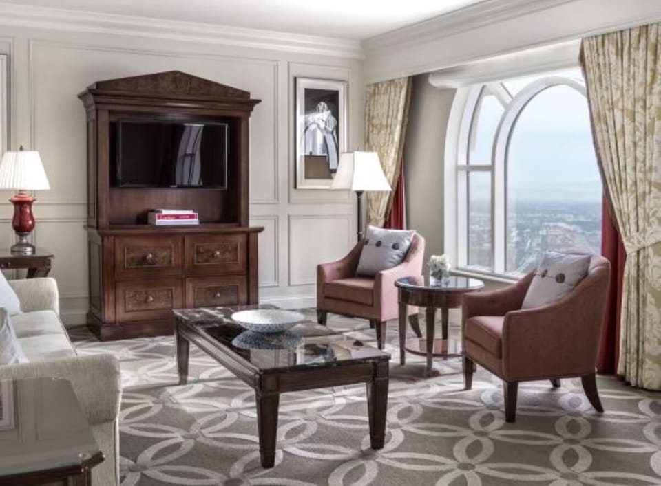 Relax by the window in a bright, stylish sitting area.