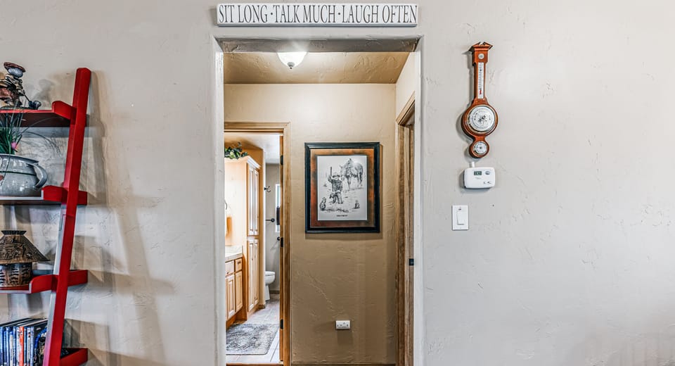 Hall leads to guest bedrooms and bath