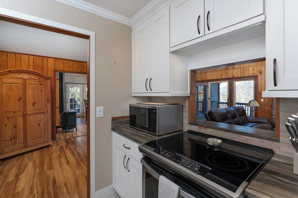 Updated kitchen with stainless steel appliances, dishwasher, and Keurig coffeemaker.