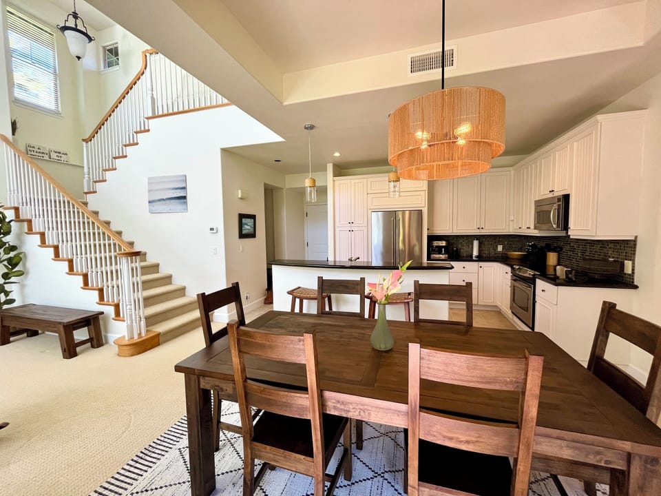 Dining, kitchen, stairs to master bedroom