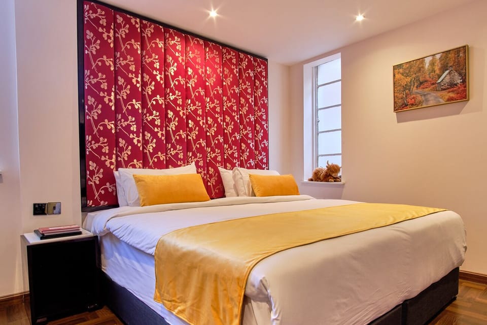 Sink into a plush king bed with warm, boutique styling.
