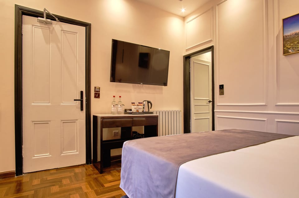 Settle in with in-room TV and a convenient refreshment station.
