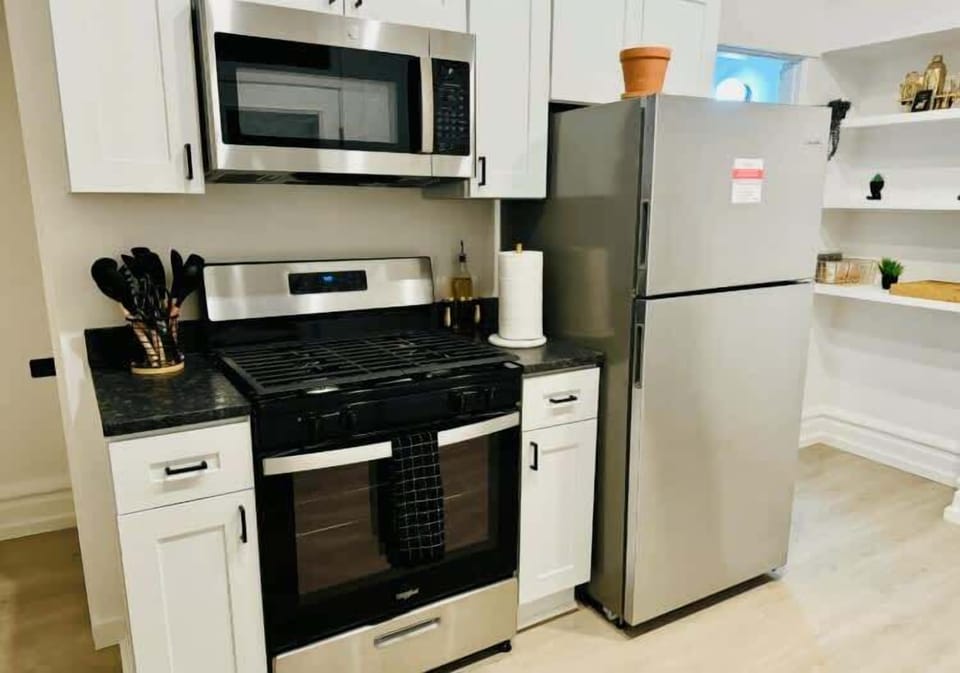 Our Columbus Airbnb kitchen is all about luxury and convenience with modern appliances, elegant countertops, and plenty of space to create your favorite dishes! Enjoy a gourmet experience right at home 