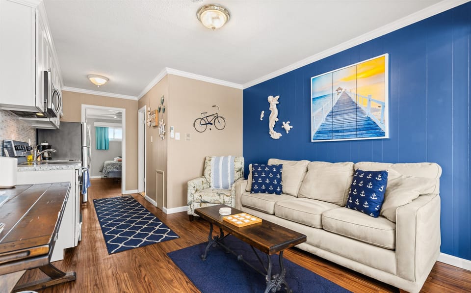 Relax in the comfortable living space with picture windows overlooking the peaceful canal. The queen-size sofa bed offers extra sleeping space.