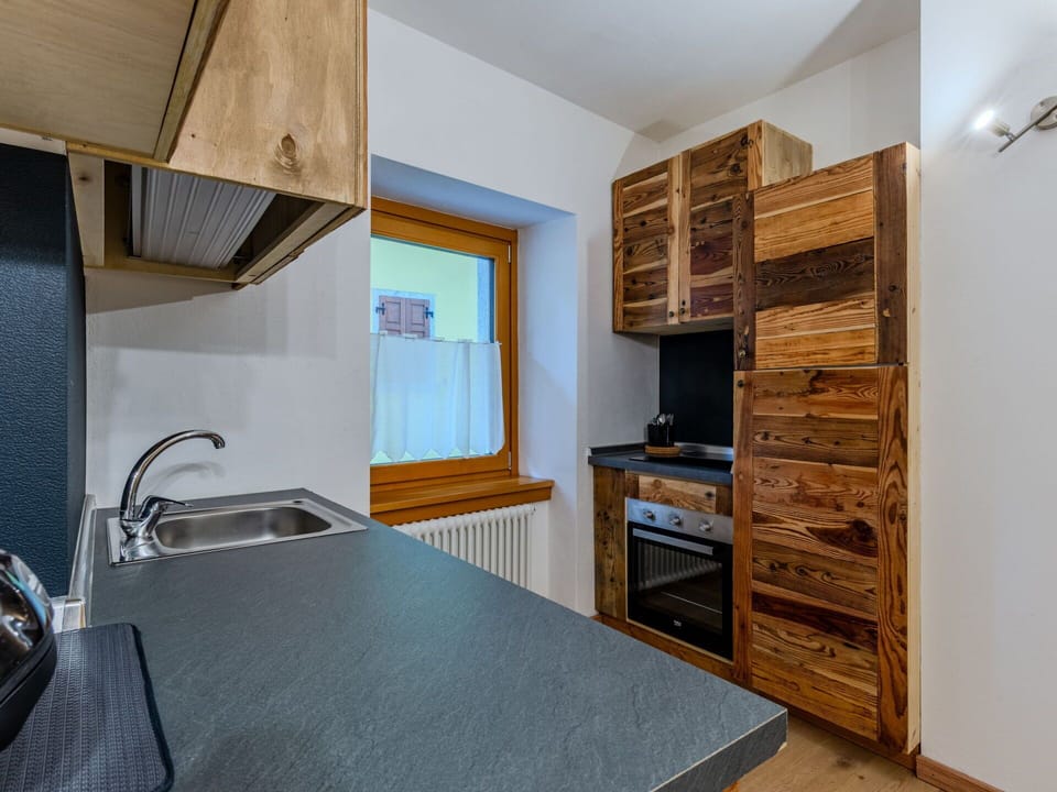 Wood, Interior Design, Flooring, Ceiling, Cabinetry, Floor, Room, Wood Stain, Countertop, Hardwood