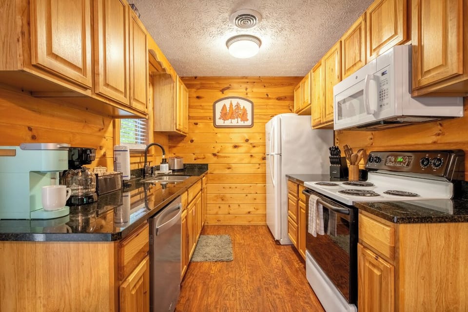 Step into your fully equipped kitchen with warm wood cabinetry, modern appliances, and everything you need to cook up your favorite meals during your stay.