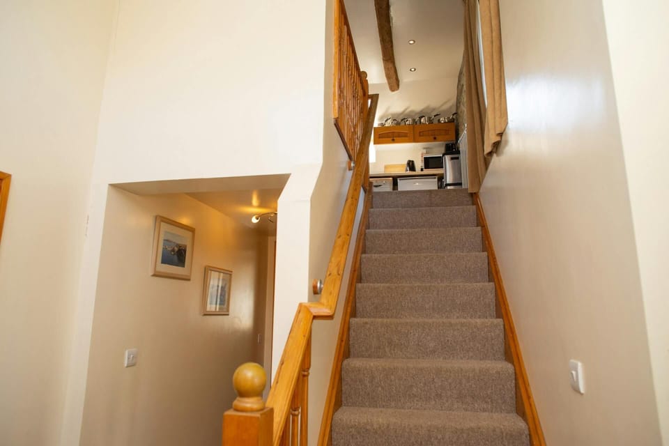 Stairs leading to first floor living accommodation