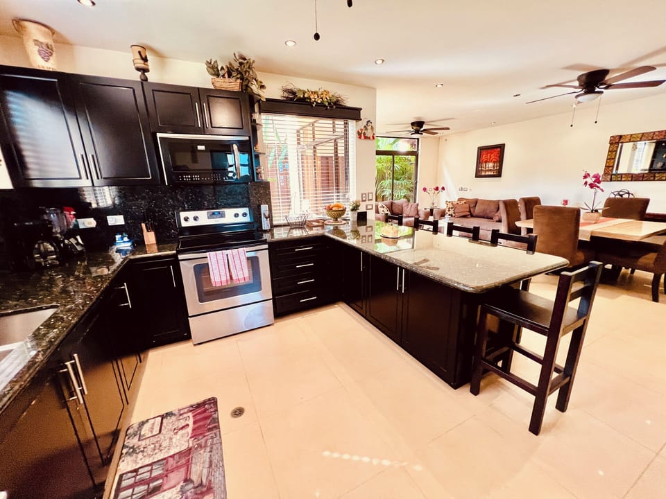 Full kitchen facing toward living / dining room.