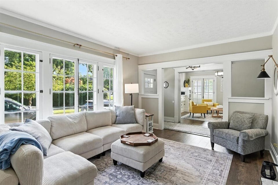 Living room on Main floor.  Sectional sofa, arm chair and tv.