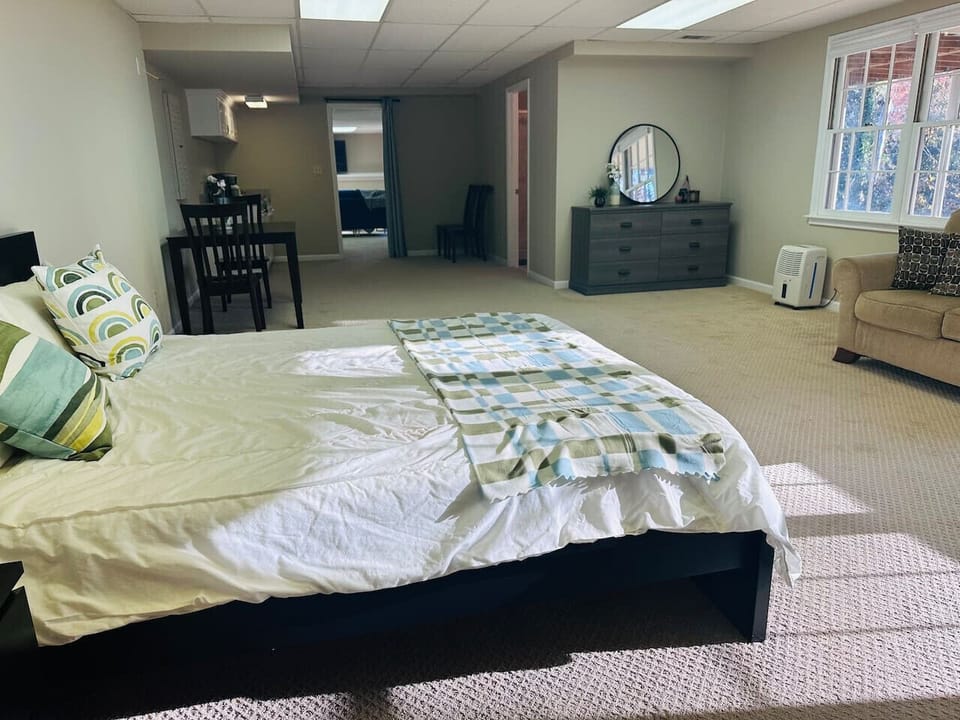 Massive bedroom area with kitchenette, dining and sitting area