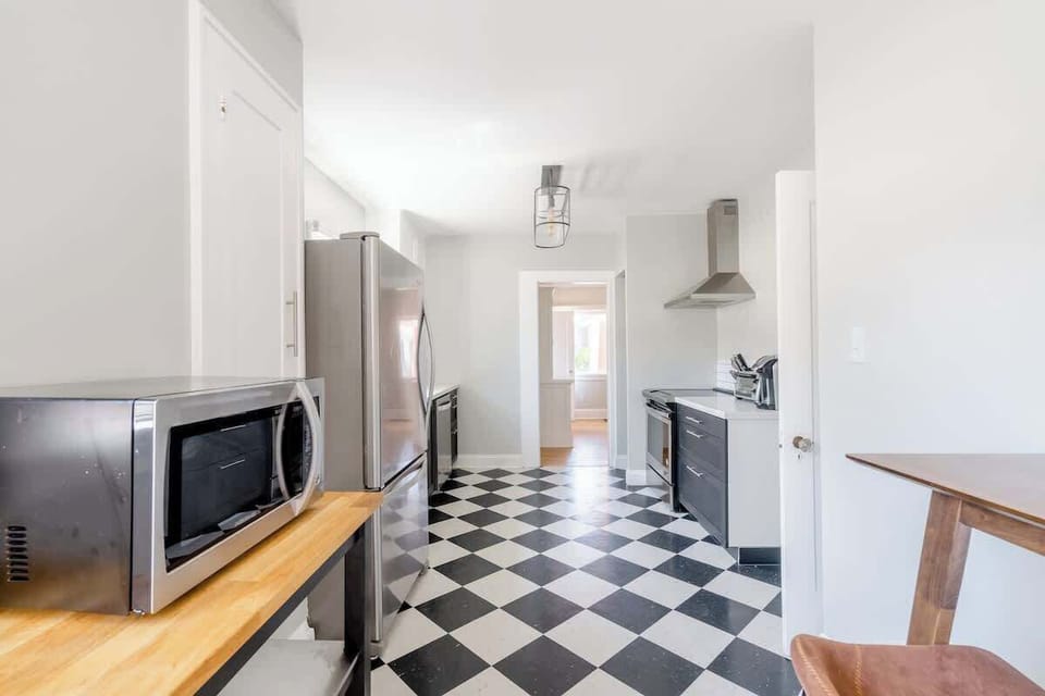 Main kitchen with checkerboard floor.