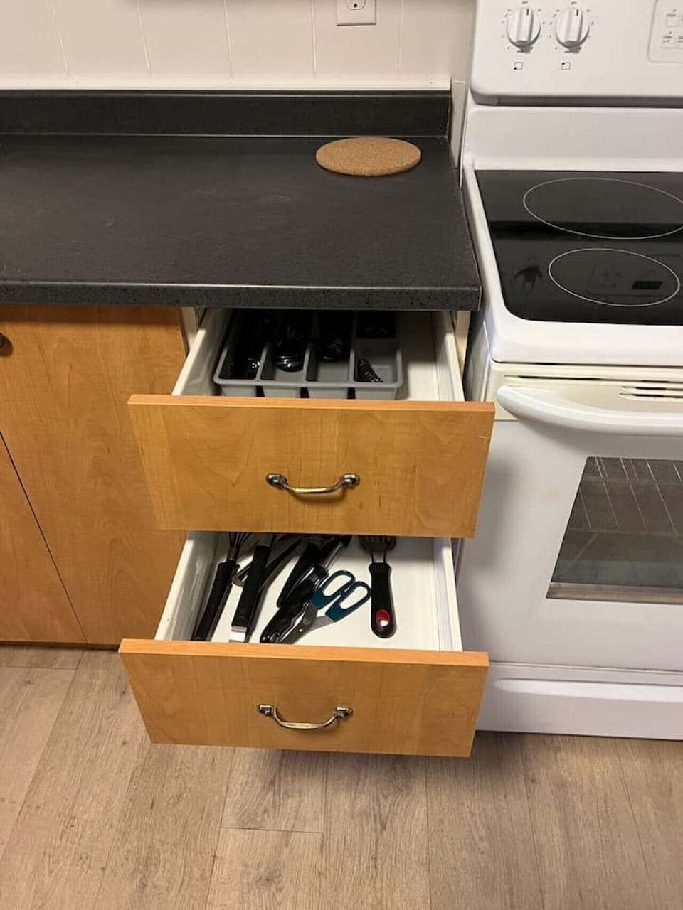Spacious kitchen featuring a large refrigerator, freezer, and dishwasher for ultimate convenience. All cooking basics and dishes provided.