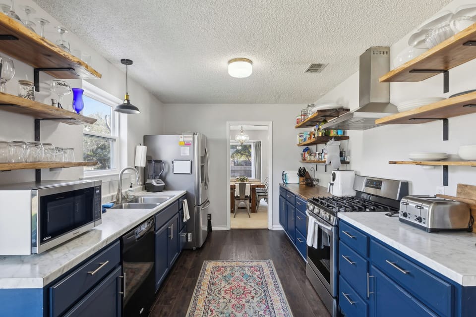 Galley, gas stove, microwave, 4-slot toaster, blender, double sink, ice machine