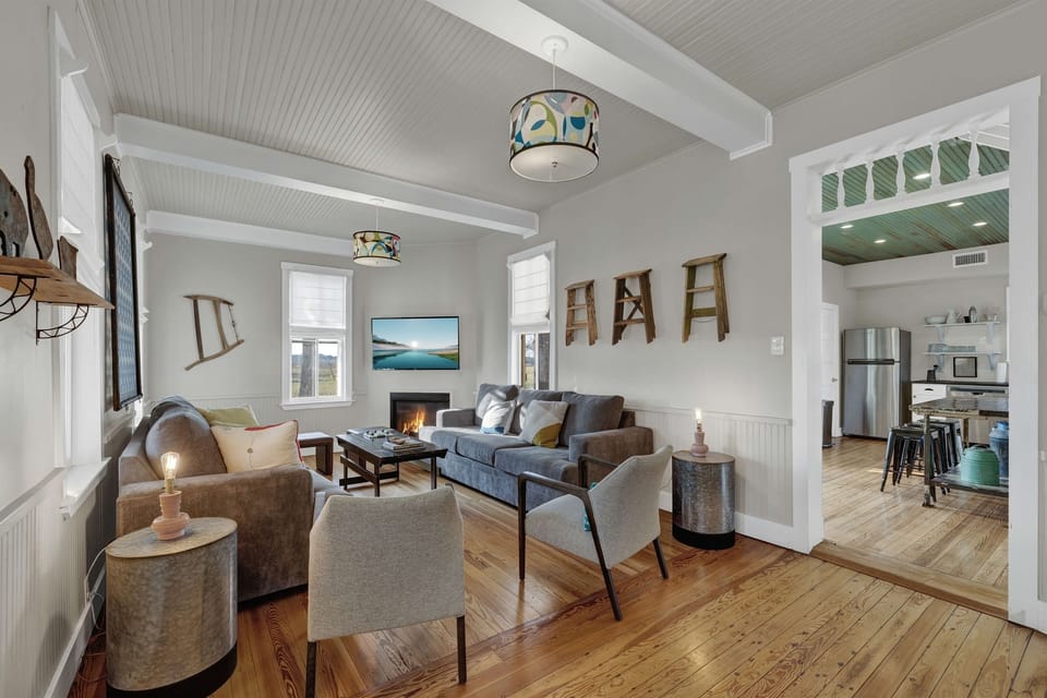 The living room is warm, open, and designed for together time. Whether you’re sipping wine, swapping stories, or diving into a late-night movie, it’s the perfect space to reconnect and relax.