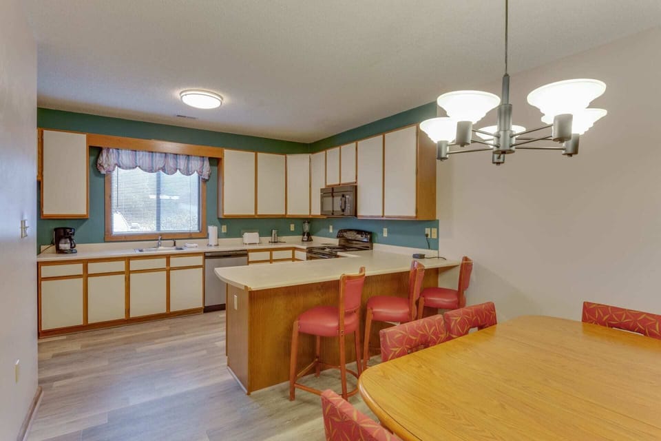 Spacious kitchen and dining area with full-size appliances—great for home-cooked meals and gatherings.