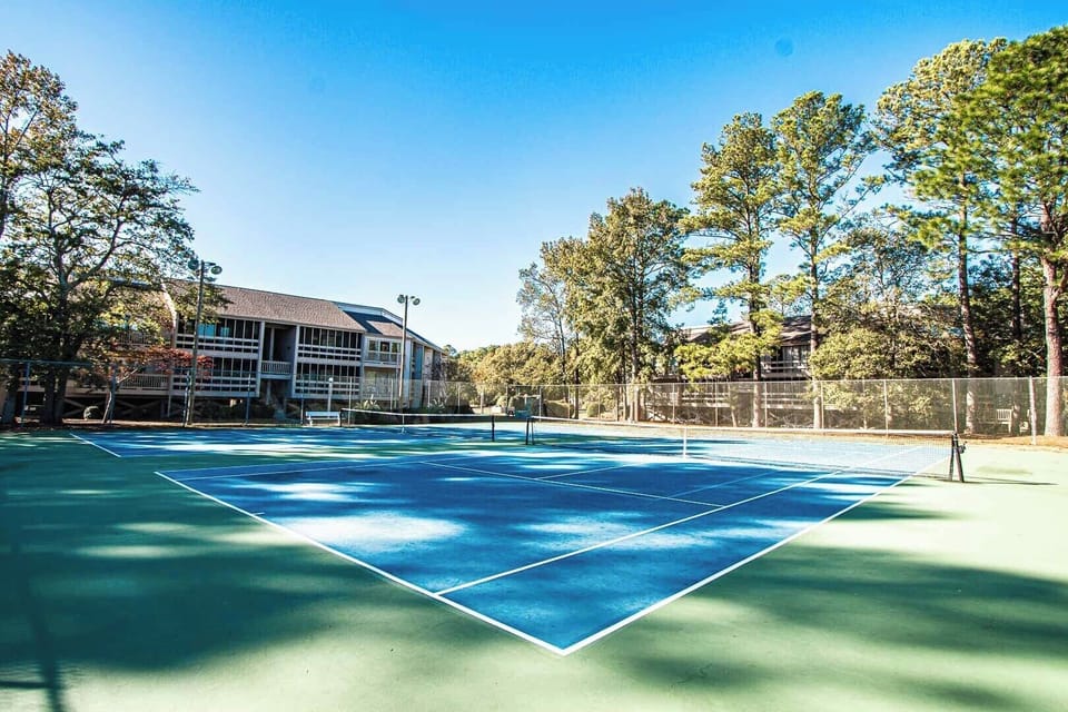Enjoy active family fun on the well-maintained tennis courts surrounded by scenic greenery in Sandcastle Village II.
