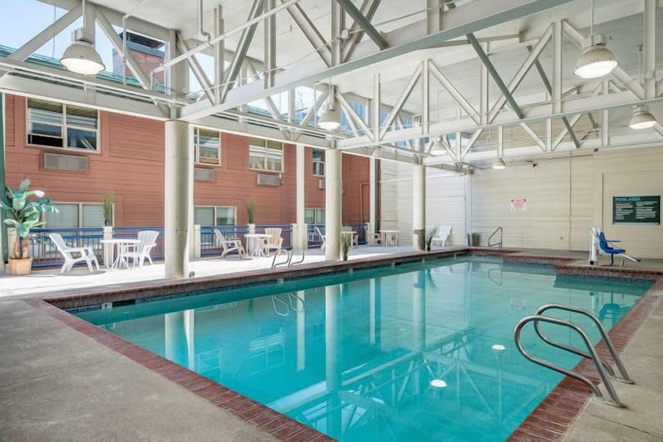 Dive into relaxation at this indoor pool area, designed to provide a refreshing escape with easy access to sun loungers perfect for unwinding after a day of skiing.