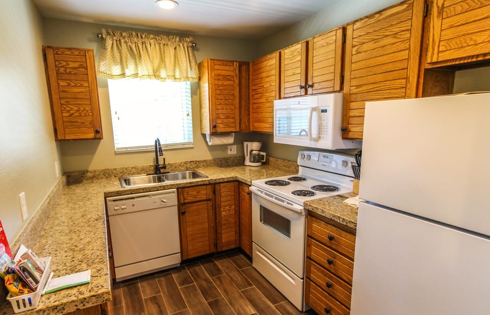 With modern appliances and ample counter space, this fully equipped kitchen is perfect for preparing meals, making your stay convenient and enjoyable in the heart of the mountains.