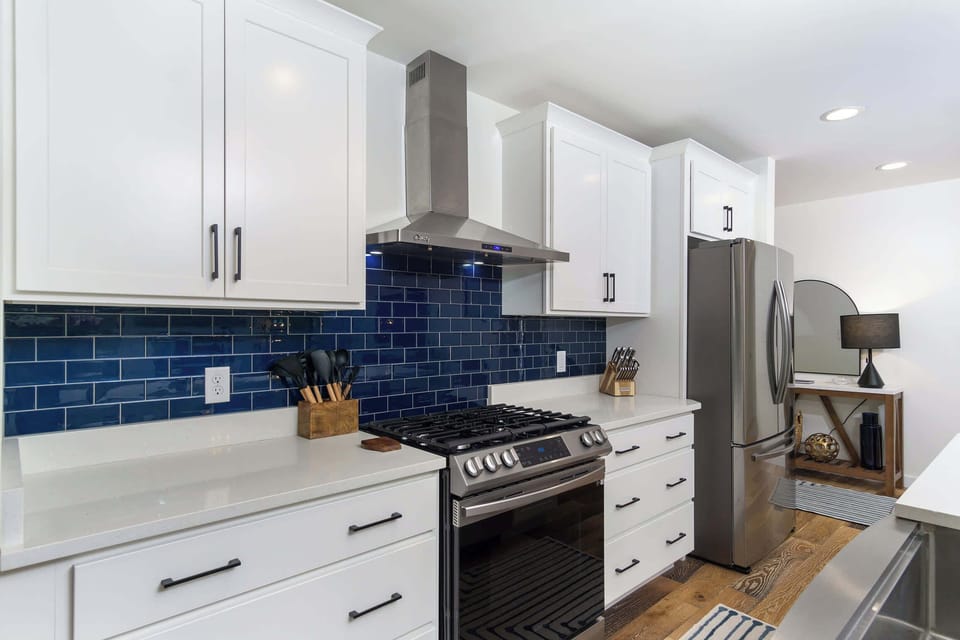 Equipped with high-end appliances, ample counter space, and every tool you need, this kitchen makes preparing meals a pleasure. 