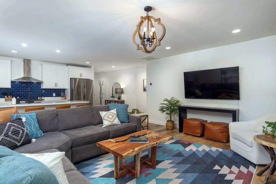 Our open floor plan invites natural light and effortless flow between the living, dining, and kitchen areas, creating a seamless environment for relaxation and entertaining. 