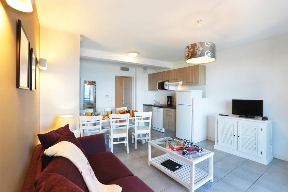 Prepare meals in the kitchenette and enjoy them at the dining table.