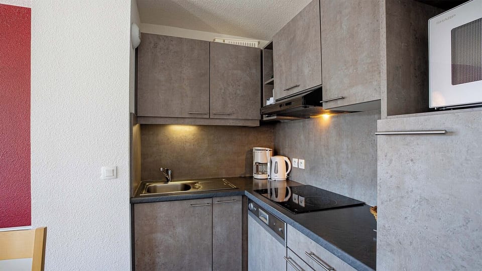 Curb your appetite by cooking a meal in your kitchen.