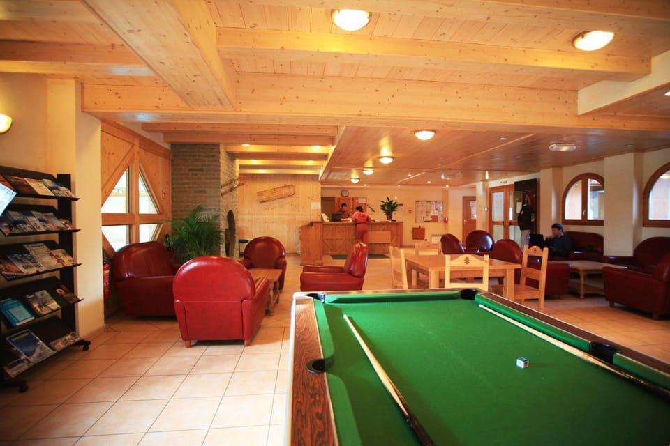 Share laughs at the pool table for a fee.