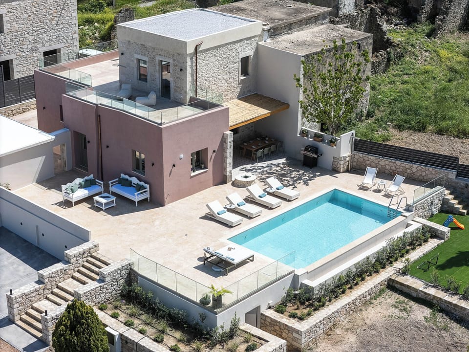 Nestled on a 4-acre estate filled with fruit trees, olive trees, a vineyard, and aromatic herbs, Balarina Residence offers a holiday escape where nature takes center stage.