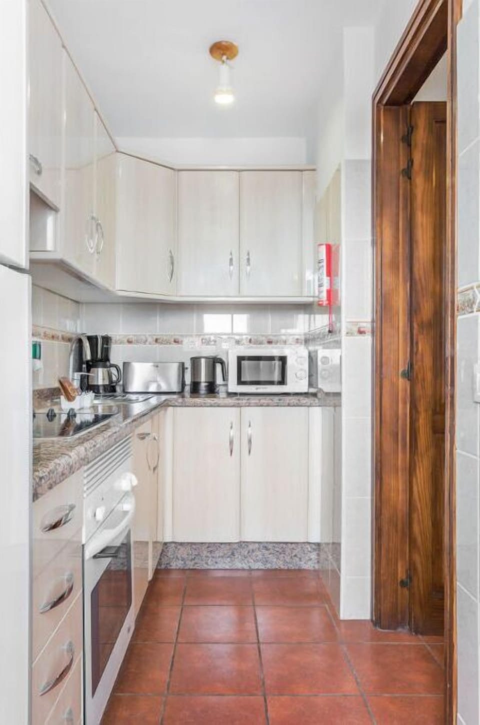 Streamlined kitchen space, complete with modern amenities for convenient meal prep.