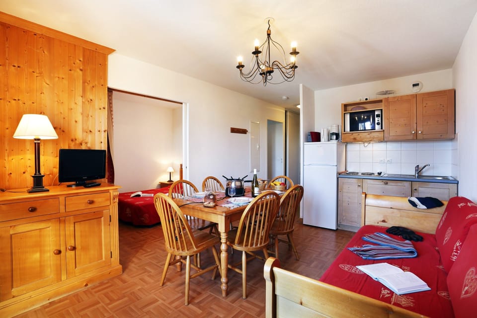 Prepare meals in the kitchen and enjoy them at the dining table.