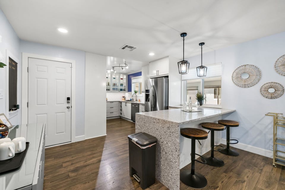 Start your mornings at the breakfast bar or wind down with a glass of wine—this kitchen is ready for both.