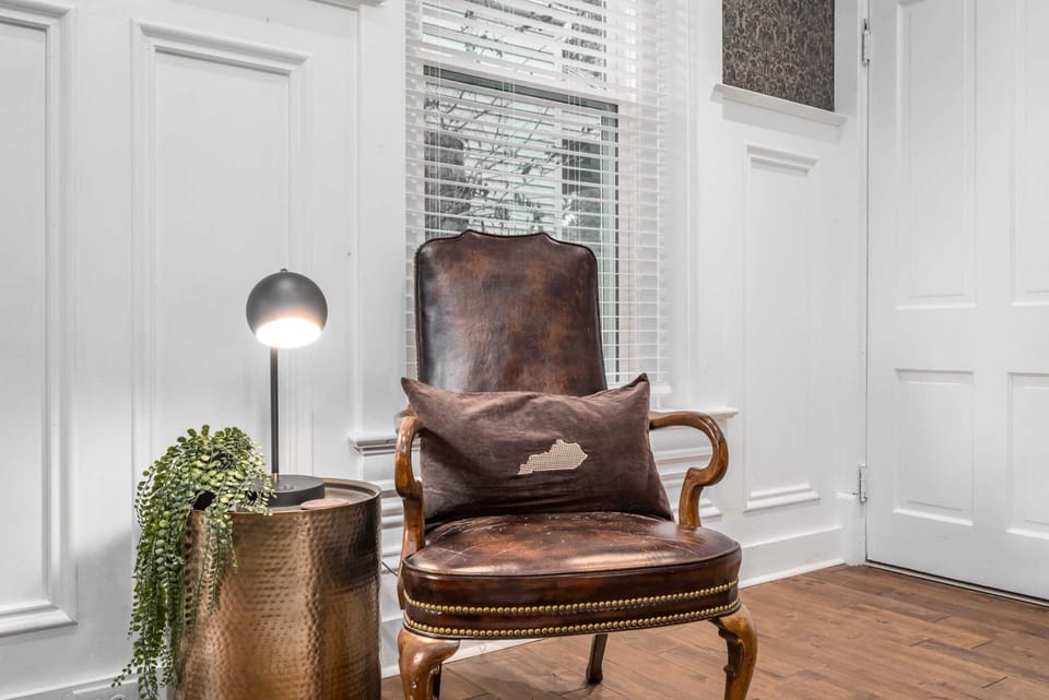 Sit on a piece of Louisville history...a vintage Churchhill Downs leather arm chair!