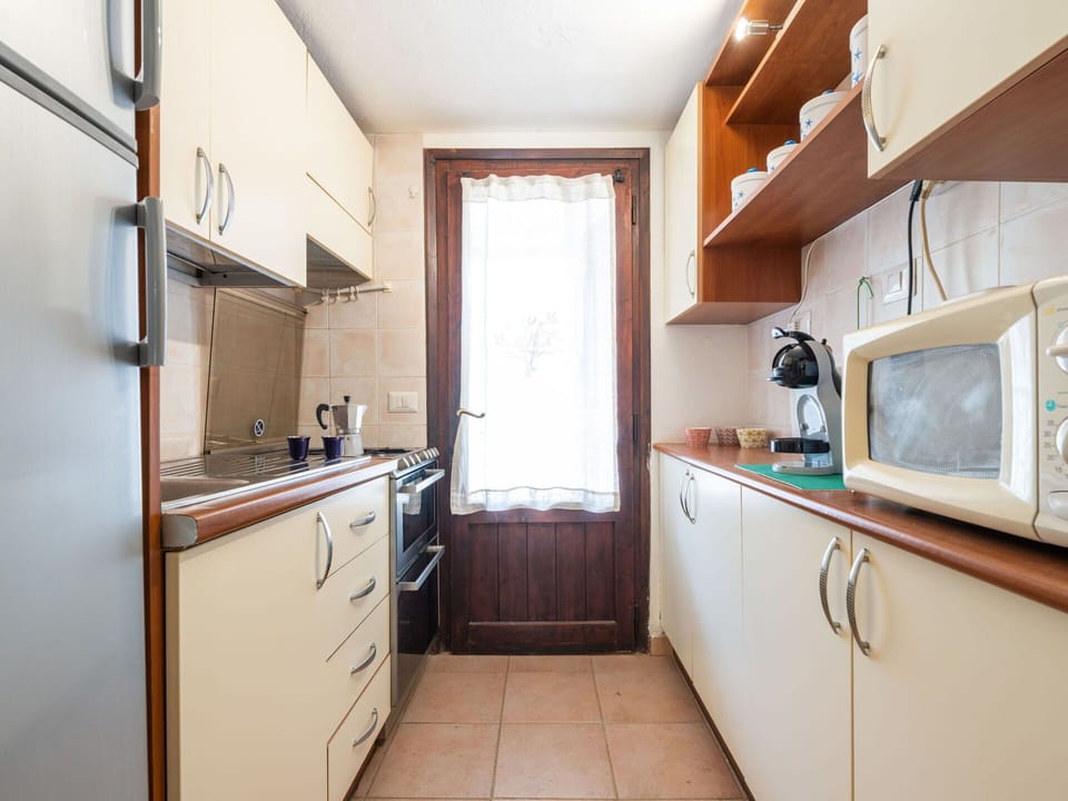 Wood, Kitchen, Major Appliance, Flooring, Countertop, Kitchen Appliance, Cabinetry, Interior Design, Furniture, Floor