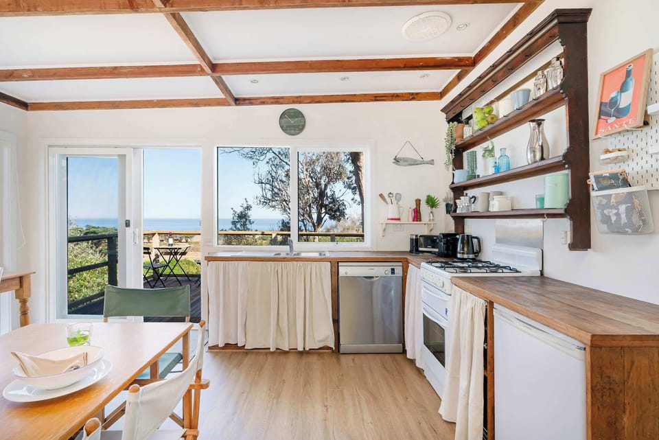 The beautiful cottage open plan living, dining and kitchen - with water views