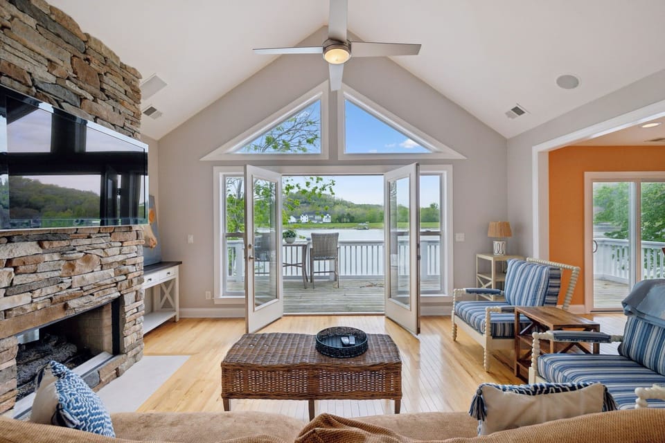 Living Room 1: Natural light meets river sights in our cozy living area!