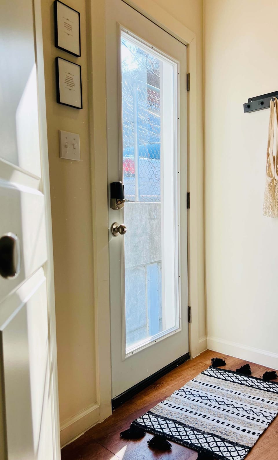 ENTRY | SECOND FLOOR: On the first floor, you'll enter our home through the kitchen. On the second floor, you enter through this door in a vestibule just off the second floor living room. Hooks are provided for your coats.