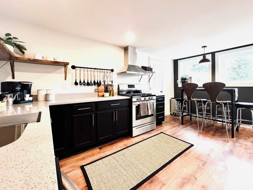 KITCHEN | FIRST FLOOR: Plates, mugs, cups, eating utensils, pots, pans, baking sheets, and pot holders are provided for your use during your stay.