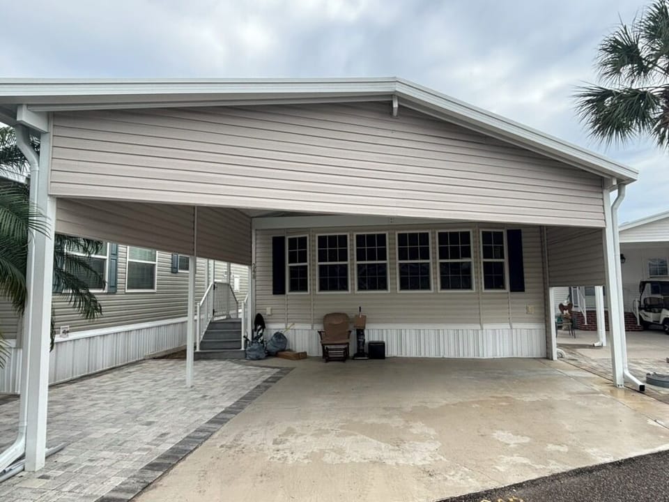 Covered car port and front of unit.