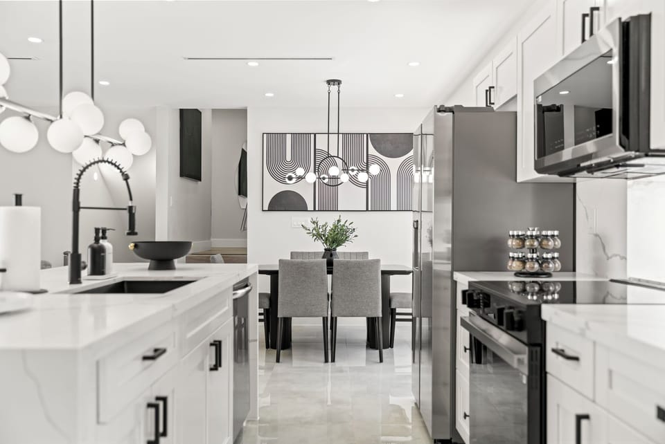 This modern kitchen boasts stunning gray and silver tones.
