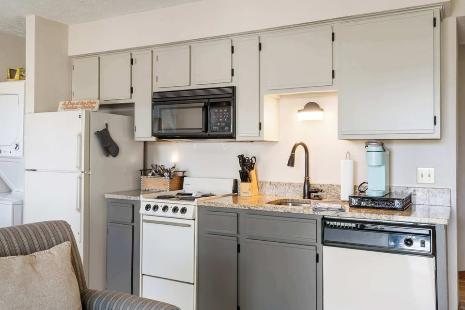 The open kitchen offers ample storage & every home comfort