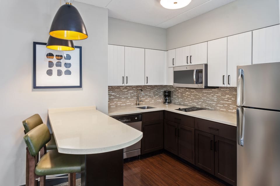 Stylish kitchen with bar seating and contemporary design elements.