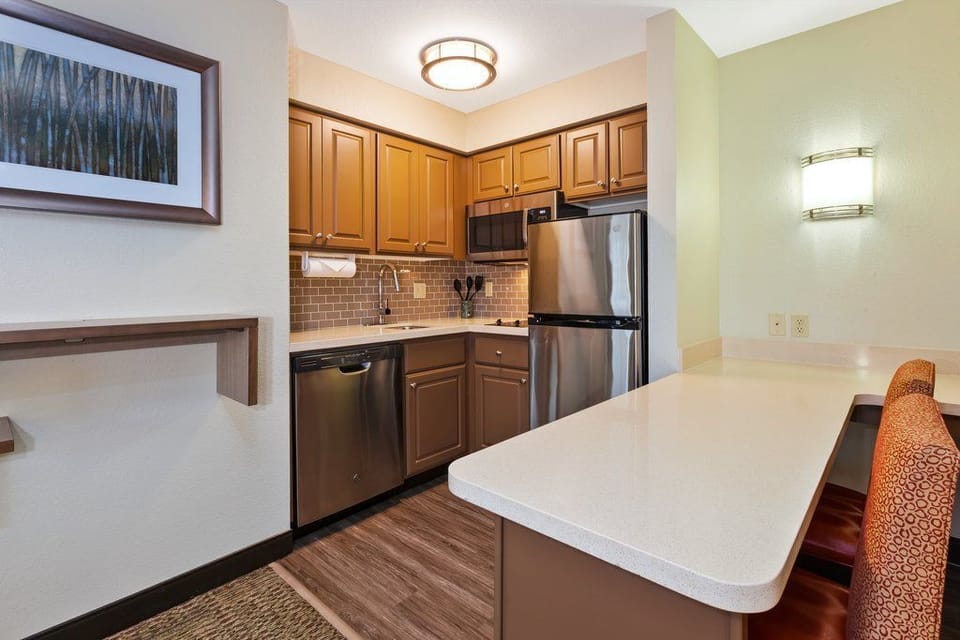 Cook up your favorite meals in this modern kitchen with sleek appliances and ample counter space.