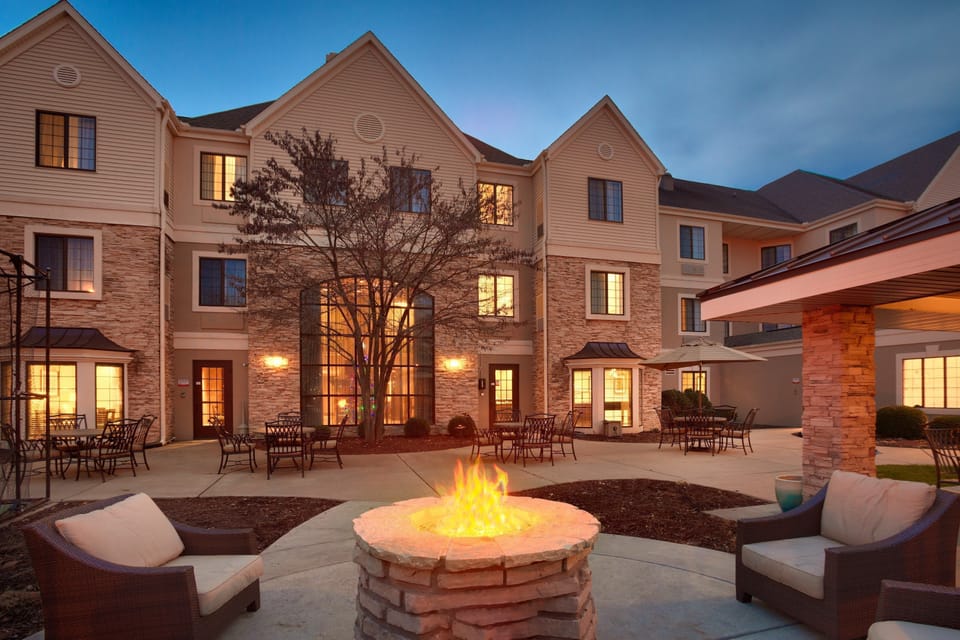 Gather around the fire pit for cozy evenings, surrounded by comfortable seating and warm ambiance.