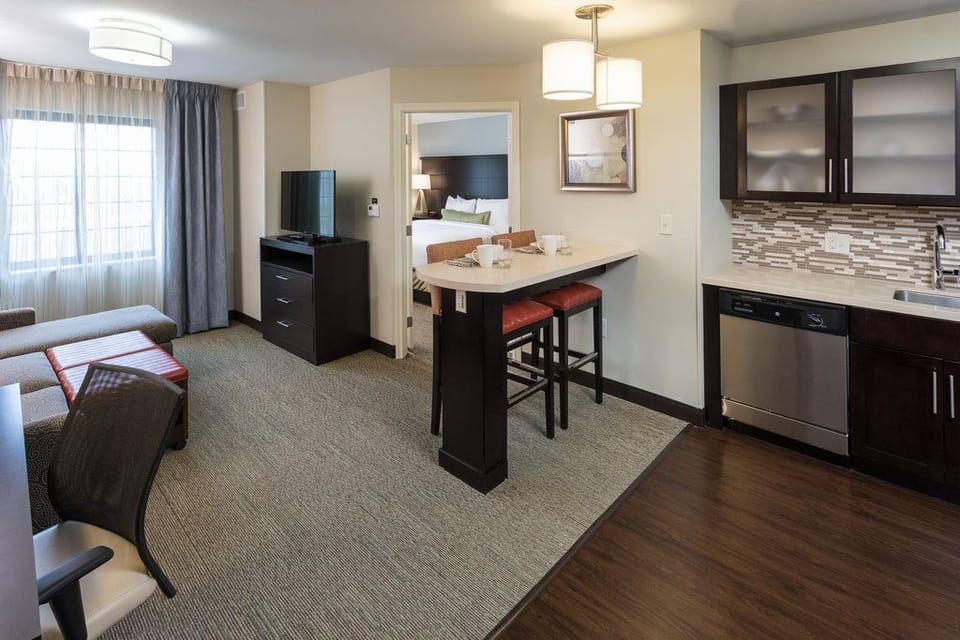 Unwind in the inviting living area, complete with a flat-screen TV and comfortable seating.