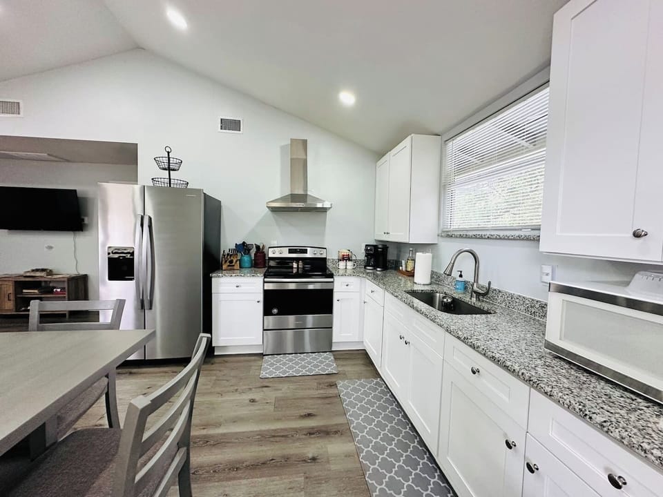 Sleek and stylish, this modern kitchen with stainless steel appliances is perfect for culinary adventures and everyday convenience.