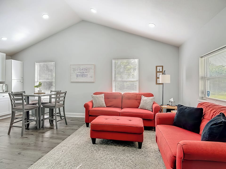 Cozy open-concept living room with comfy couches, a TV, and complimentary Netflix for easy nights in.
