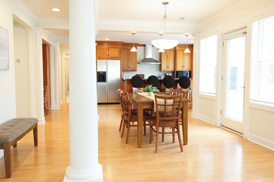 Kitchen table has 6 chairs at it but there are two more and a bench if needed.