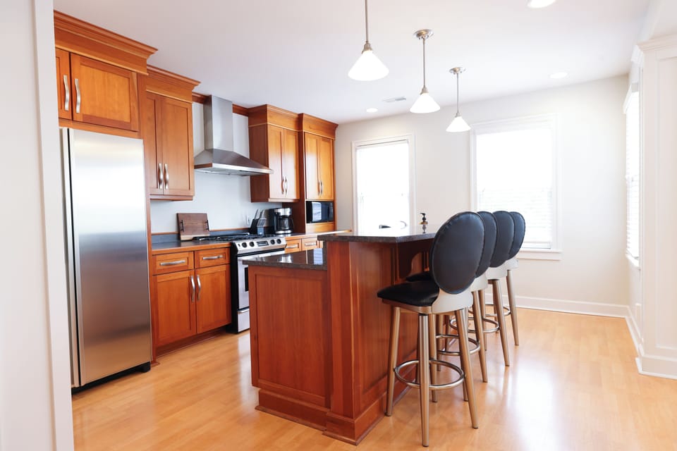 The high top bar is equipped with 4 swivel bar stools.