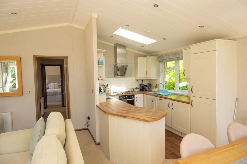 The open plan kitchen is equipped with all necessities. 